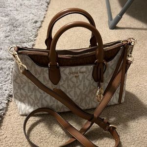 Michael Kors white with brown hand held or crossbody purse.